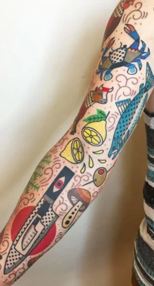 Patchwork tattoo for women: crab, lemon, fish, knife on arm