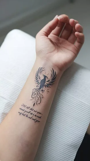 Phoenix and Quote fine line tattoo for women on wrist and forearm