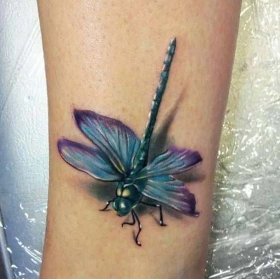 Realistic 3D effect dragonfly tattoo design for men and women on calf tattoo ideas