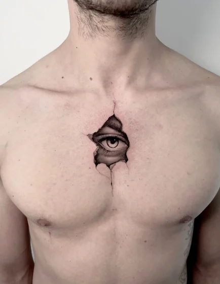 Realistic 3D eye through cracked skin tattoo design for men on chest