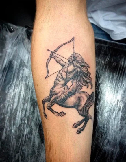 Realistic Black And Grey Sagittarius centaur tattoo idea for men on forearm