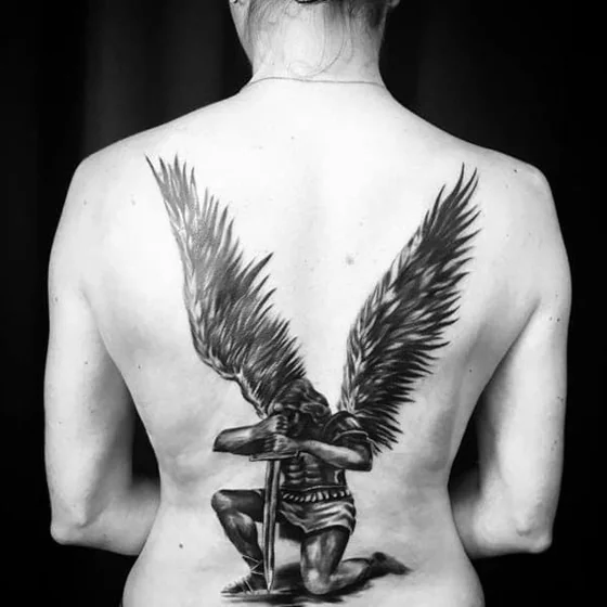 Realistic Black And Grey Saint Michael Angel tattoo design for women on back
