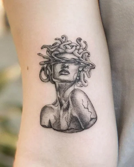 Realistic Medusa fine line tattoo design for women on upper arm