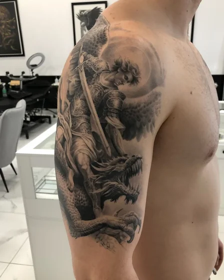Realistic Saint Michael and dragon tattoo idea for men on arm