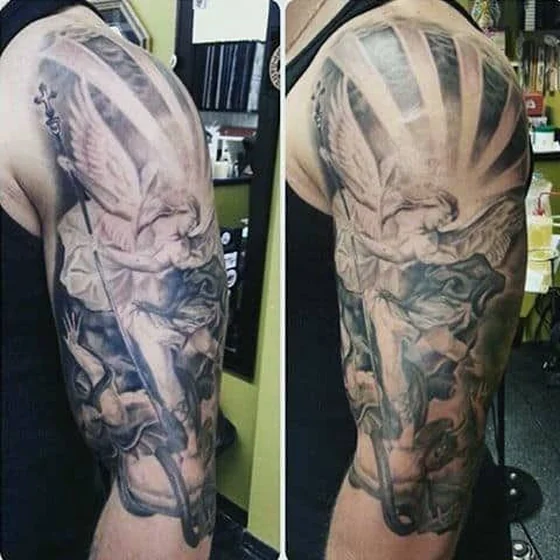 Realistic Saint Michael, wing, sun design for men on upper arm