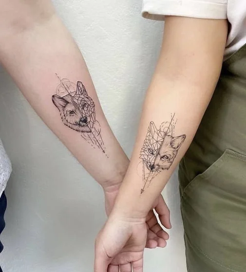 Realistic and geometric wolf tattoo design for men and women on forearm