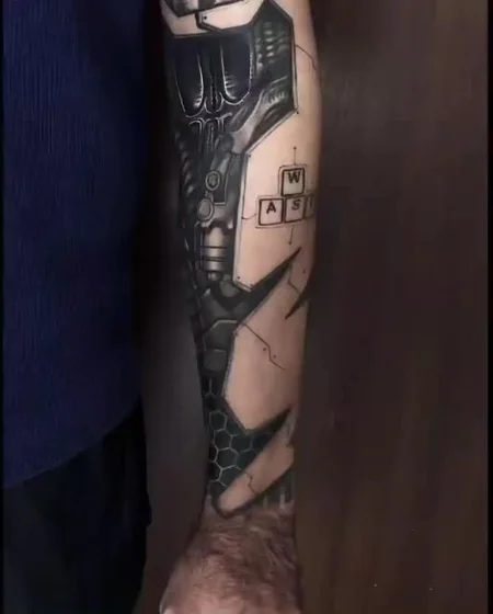 Realistic biomechanical mechanic video game tattoo design for men on forearm