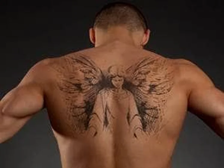 Realistic black and grey angel with wings tattoo idea for men on back