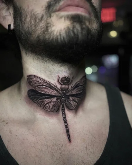 Realistic black and grey dragonfly tattoo idea for men on neck tattoo ideas