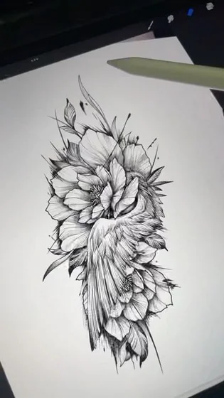 Realistic black and grey floral wing tattoo design for women