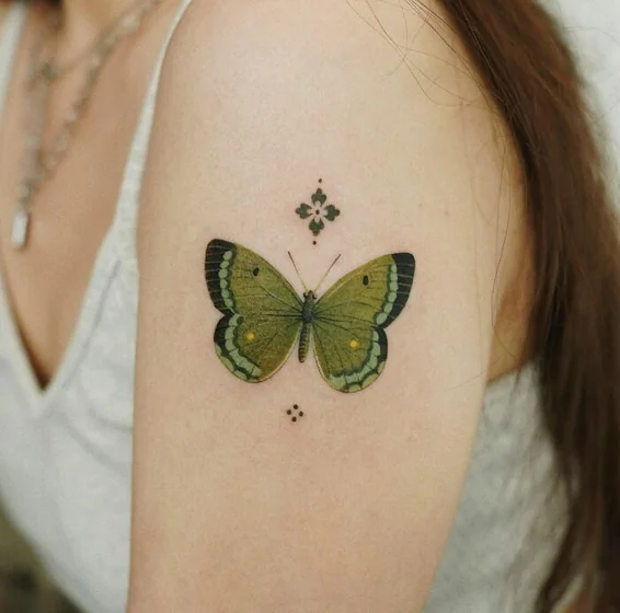 Realistic butterfly tattoo design for women on Upper Arm