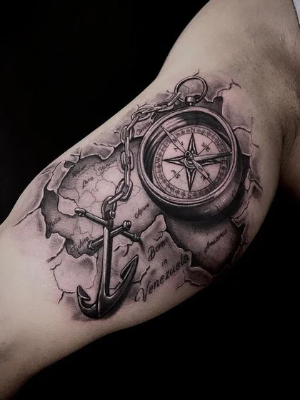 Realistic compass, anchor, map tattoo design for men on upper arm