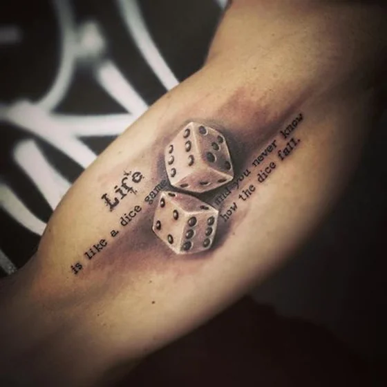 Realistic dice and quote tattoo design for men on upper arm