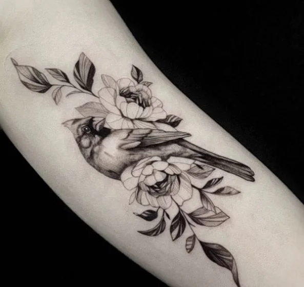 Realistic fine line cardinal and floral tattoo design for women on forearm