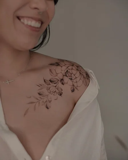 Realistic fine line floral tattoo design for women on shoulder and chest