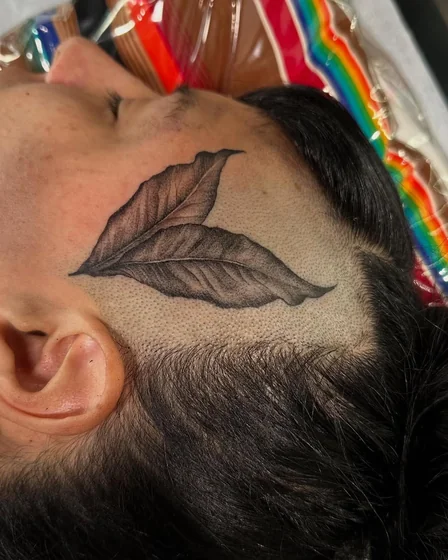 Realistic floral tattoo design for men on face