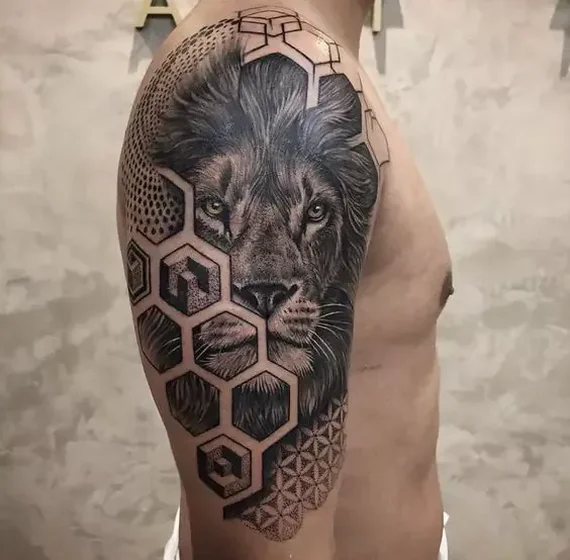 Realistic geometric lion tattoo design for men on upper arm and shoulder