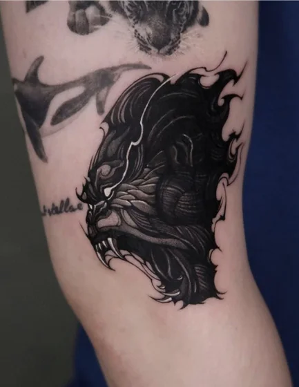 Realistic gorilla, orca, and tiger patchwork tattoo idea for men on arm