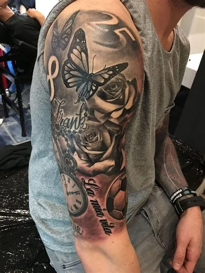 Realistic script butterfly, rose, clock, soccer ball tattoo for men on arm