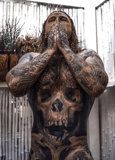 Realistic skull and Japanese waves tattoo idea for men on chest and full sleeve