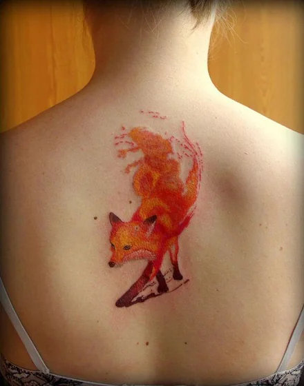Realistic watercolor fox tattoo idea for women on back