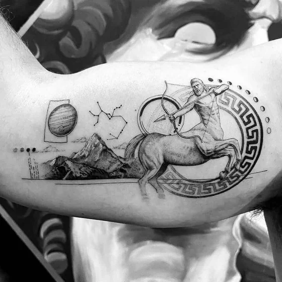 Sagittarius centaur, mountain, constellation tattoo idea for men on upper arm.