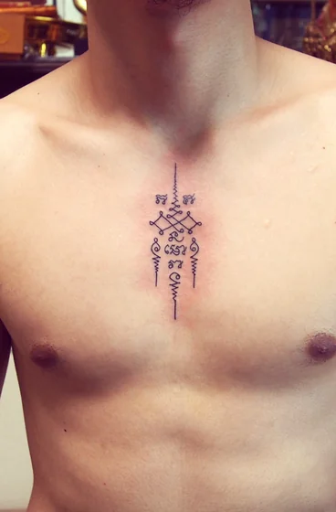 Sak Yant Fine Line tattoo design for men on chest and sternum.