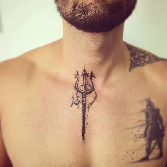 Sketchy trident and number 13 tattoo design for men on sternum