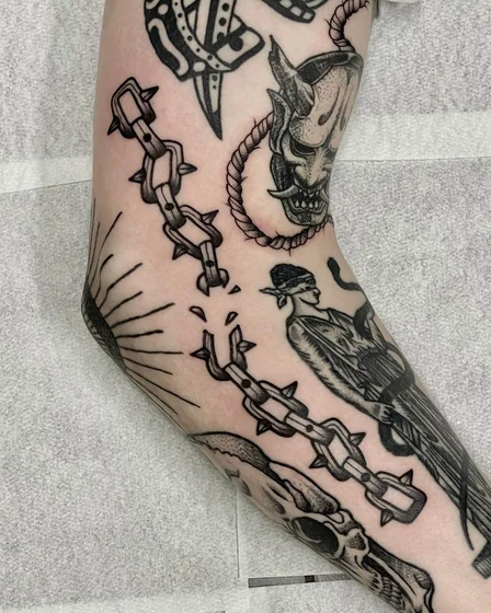 Traditional Patchwork tattoo: Hannya mask, chain, skull arm.