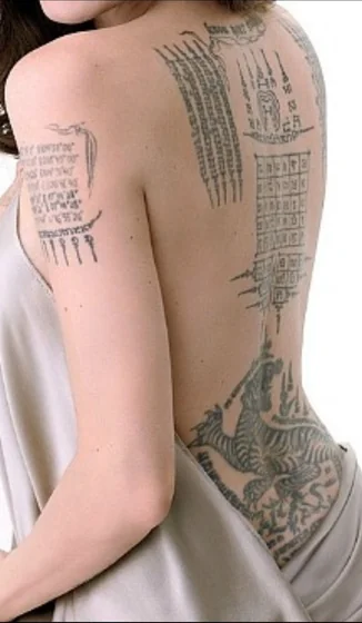Traditional Sak Yant tiger & Thai script tattoo for women on back & shoulder