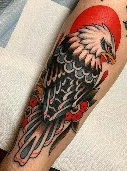 Traditional eagle and floral tattoo design for men and women on forearm
