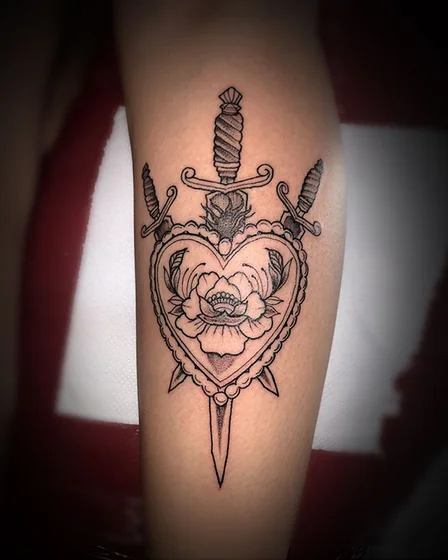 Traditional heart, flower, dagger tattoo idea for men and women