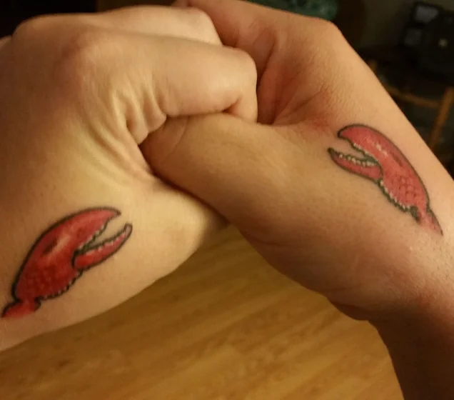 Traditional lobster claw tattoo design for men and women on hand