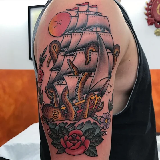 Traditional octopus, nautical, rose tattoo for men on upper arm