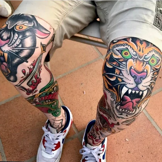 Traditional patchwork tiger, snake, panther tattoo idea for men on leg and knee
