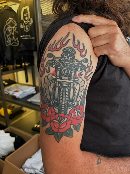 Traditional skull, motorbike, rose tattoo design for men on arm.
