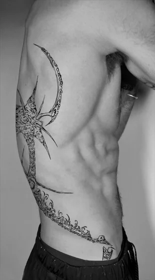 Tribal Blackwork abstract spiky tattoo design for men on rib and hip tattoo ideas