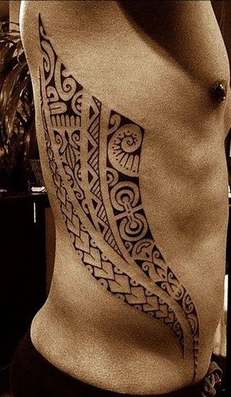 Tribal Polynesian pattern tattoo idea for men on rib and hip