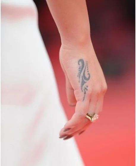 Tribal abstract pattern tattoo design for women on hand and finger