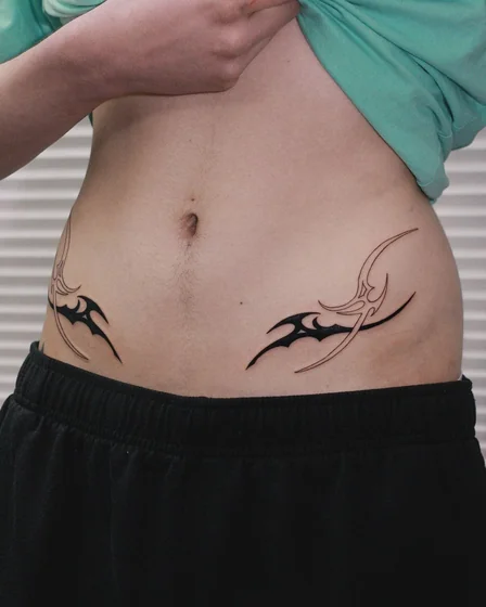 Tribal abstract pattern tattoo idea for men on hip