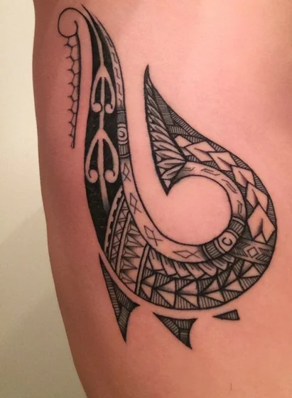 Tribal blackwork Maori fish hook tattoo idea for men/women on rib