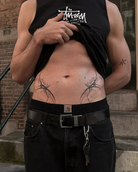 Tribal blackwork and star tattoo design for men on hip and upper arm tattoo ideas