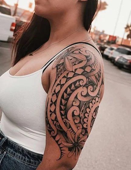 Tribal floral half sleeve tattoo design for women on shoulder.