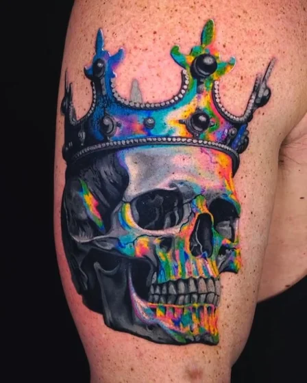 Vibrant Realism skull & crown tattoo for men/women on upper arm