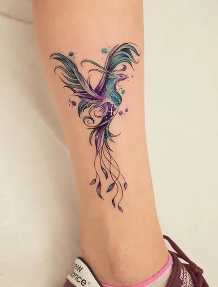 Watercolor Phoenix tattoo idea for women on calf and ankle