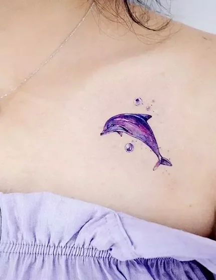 Watercolor dolphin tattoo design for women on chest