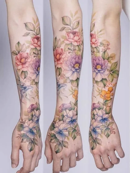 Watercolor floral tattoo design for women on forearm and hand
