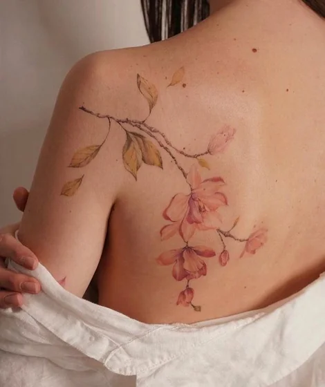 Watercolor floral tattoo design for women on shoulder and back