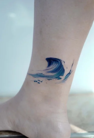Watercolor ocean wave tattoo design for men and women on ankle