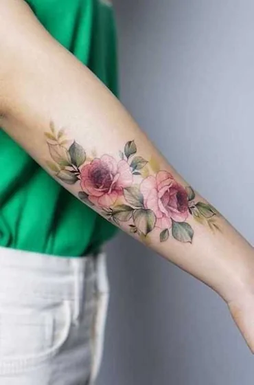 Watercolor realistic rose floral tattoo design for women on forearm